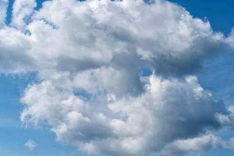 Cloudscape with white fluffy clouds in sunset sky Foto stock