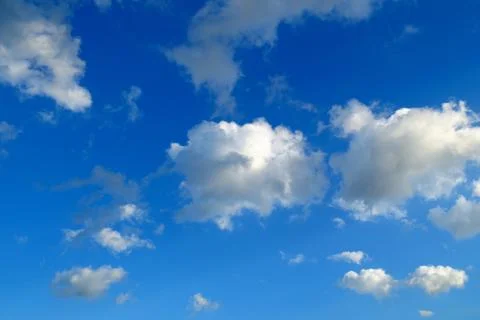 Cloudscape with wispy cloud in blue sky Stock Photos