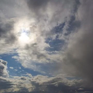 Clouds,United States,Sun behind grey clouds and glimpses of blue sky, Stock Photos