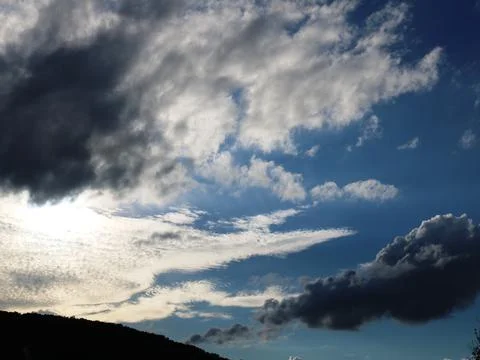 Cloudy airspace with different clouds Stock Photos
