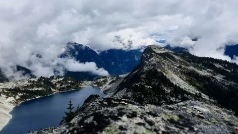 Cloudy alpine lake Video stock 318557553
