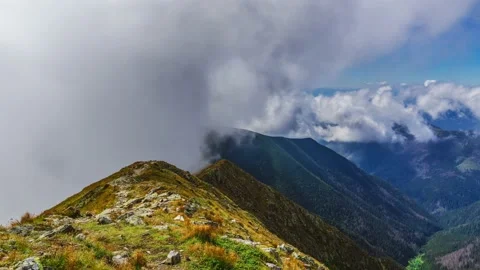 Cloudy and clear side of mountain ridge. Stock Footage 151266257