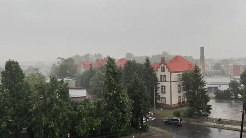 Cloudy and rainy day in a small town, crossroads of streets Stock Footage 252045255