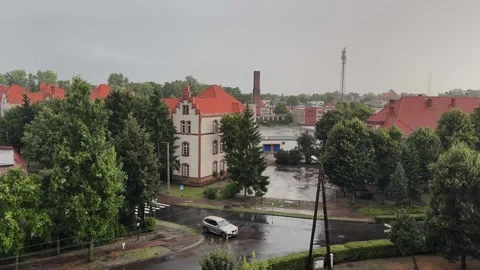 Cloudy and rainy day in a small town, crossroads of streets Stock Footage 252045293