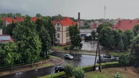 Cloudy and rainy day in a small town, crossroads of streets Stock Footage 252045294