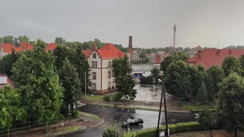 Cloudy and rainy day in a small town, crossroads of streets Stock Footage 252045411