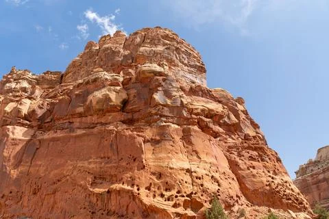 A cloudy and sunny view of red rocks at Capitol Reef National Park in Utah. Stock Photos