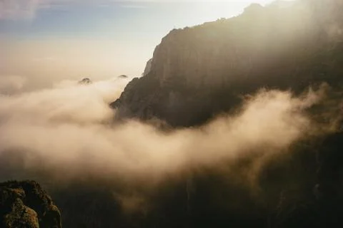 Cloudy atmospheric landscape with steep cliffs Stock Photos