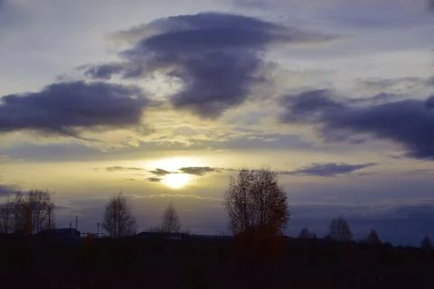Cloudy autumn evening in the fields of the Western Urals Stock Photos