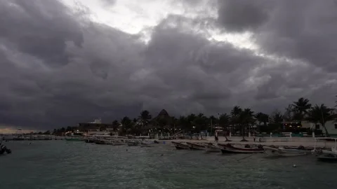 Cloudy beach day with many moored boats in mexico Stock Footage 168910421
