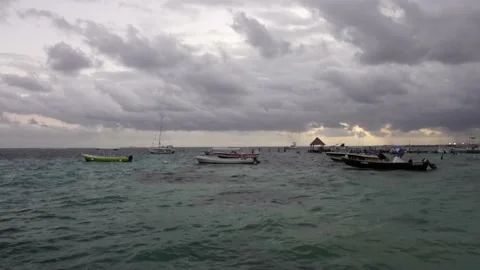 Cloudy beach day with many moored boats in mexico Vídeo Stock 168910493