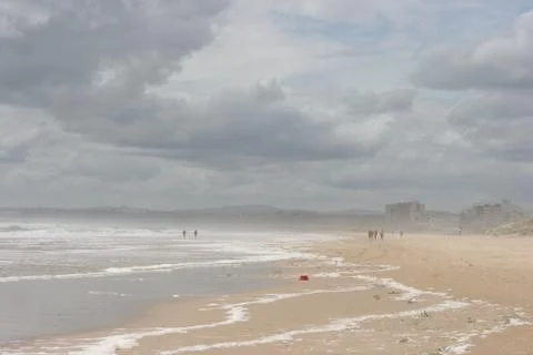Cloudy beach Stock Photos