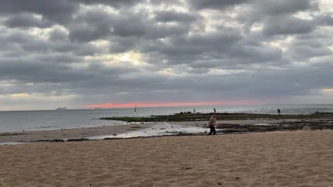 Cloudy Beach Seascape with People Walking Video stock 330270132