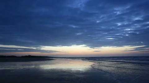 Cloudy blue dawn at cherry grove beach, sc Stock Footage 49227088