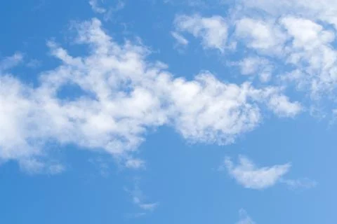 Cloudy blue sky abstract background, blue sky background with tiny clouds, bl Stock Photos