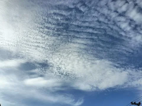 Cloudy blue sky background. Bottom-up view of the sky Stock Photos
