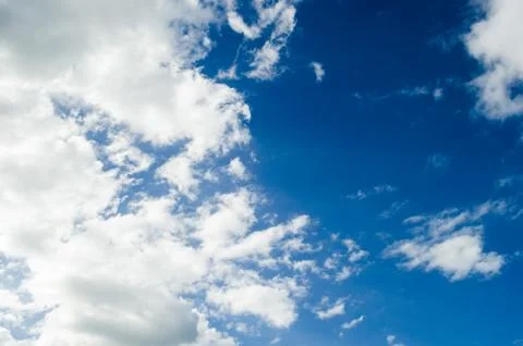 Cloudy blue sky with gray clouds, nature background with blue texture and sha Stock Photos