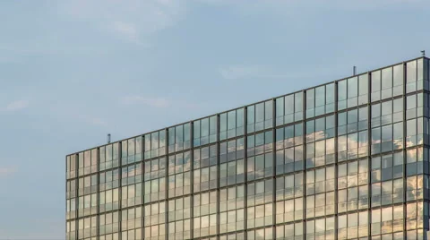 Cloudy blue sky with modern illuminated reflection glass  facade timelapse Stock-Footage 53247180
