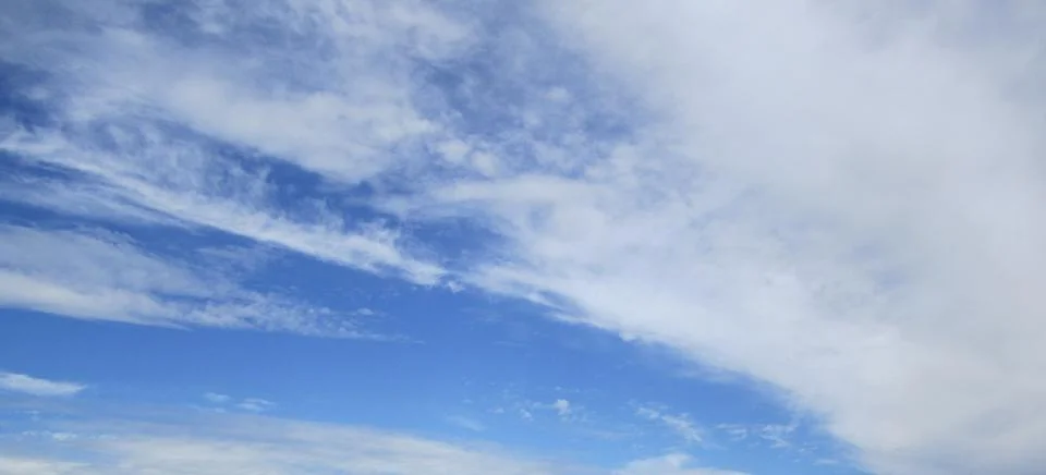 Cloudy blue sky Stock Photos