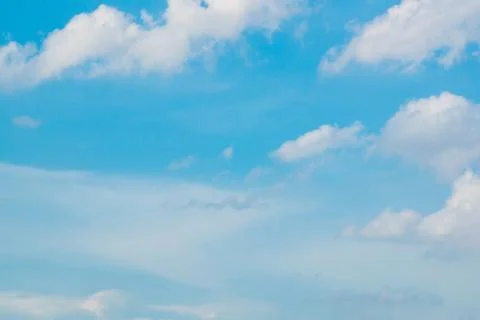 Cloudy bright blue sky background Stock Photos