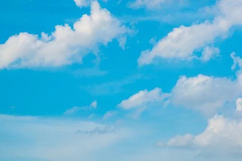 Cloudy bright blue sky background Stock Photos