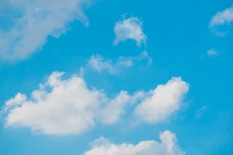 Cloudy bright blue sky background Stock Photos