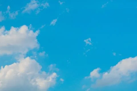 Cloudy bright blue sky background Stock Photos