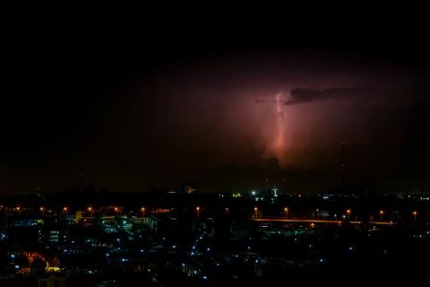 Cloudy with Bright lightning bolt strikes in the rural landscape of small cit 스톡 사진
