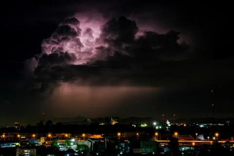 Cloudy with Bright lightning bolt strikes in the rural landscape of small cit 스톡 사진