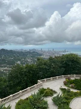 A cloudy cityscape view of Batumi from an elevated garden terrace Stock Photos