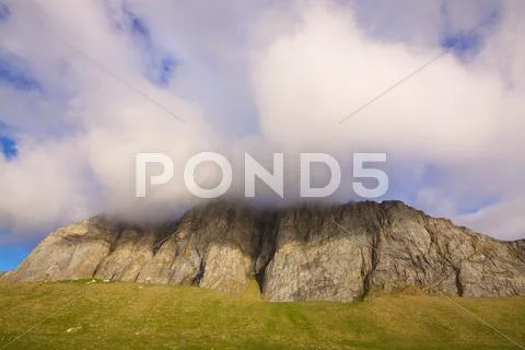 Cloudy cliffs Stock Photos