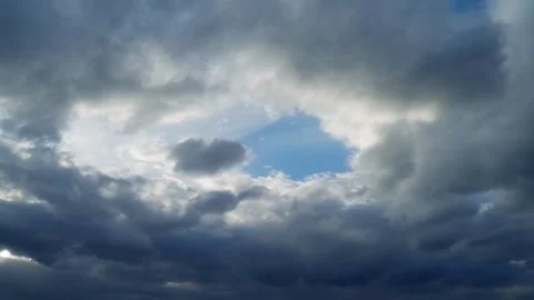 Cloudy clouds and blue sky breaking through them. Stock Footage 275081459