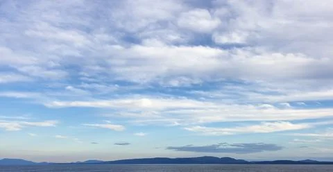 Cloudy Cloudscape during sunny summer Day on the West Coast of Pacific Ocean. Stock Photos
