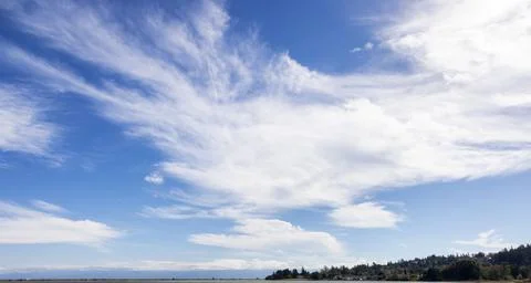Cloudy Cloudscape during sunny summer Day on the West Coast of Pacific Ocean. Stock Photos