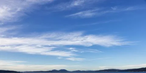 Cloudy Cloudscape during sunny summer Day on the West Coast of Pacific Ocean. Stock Photos