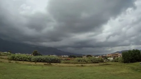 Cloudy countryside landscape, sheep moving, time lapse Stock Footage 78600778