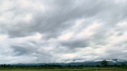 Cloudy covered sky and mountain green field in countryside, nature landscape Stock Footage 198809745