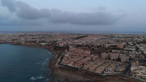 Cloudy dawn above Torrevieja seen from air, rocky shoreline and few signs o.. Stock Footage 314134322