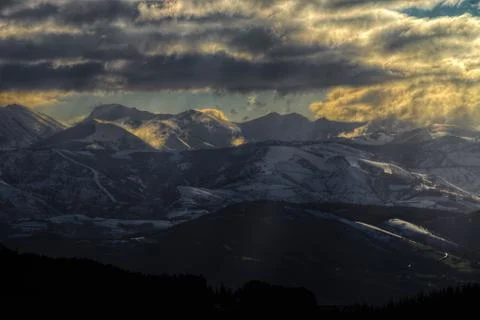 Cloudy dawn over the mountains Stock Photos