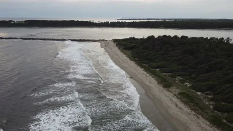 Cloudy day and strong waves at the beach - Drone/Aerial Shot Stock Footage 144224432