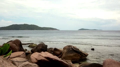 Cloudy day at the beach at the seychelles in 4K Stock Footage 71534737