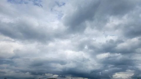 Cloudy day with dark, gray clouds and a chance of rain. Stock Photos