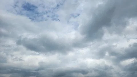 Cloudy day with dark, gray clouds and a chance of rain. Stock Photos