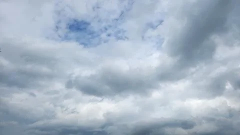 Cloudy day with dark, gray clouds and a chance of rain. Stock Photos