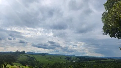 Cloudy day with dark, gray clouds and a chance of rain. Stock Photos