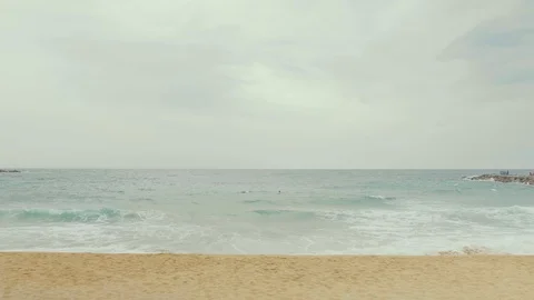Cloudy day endless landscape. Beach Spain, Barcelona 03.05.2019. Sand, sea, wind Stock Footage 114344894