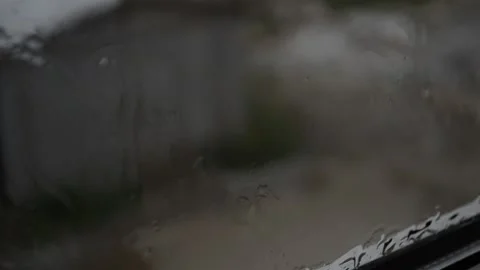 Cloudy day outside the window, the rain with hail Stock Footage 119124441