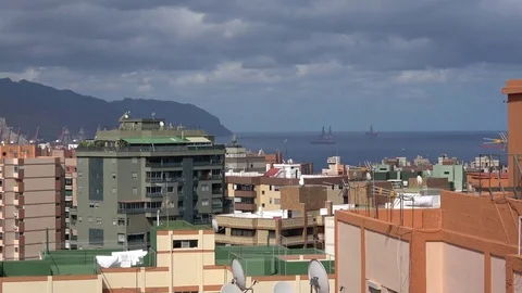 Cloudy day over the city with offhore drilling platforms in background in Santa Video stock 80621688