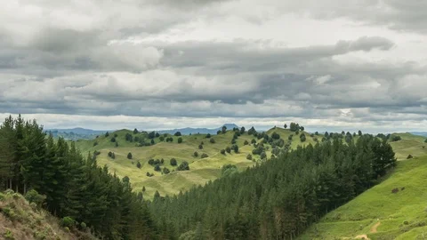 Cloudy day over green mountains nature in New Zealand landscape Time lapse Stock Footage 106177334