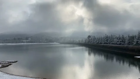 Cloudy Day Over Lake With Light Snow Falling Stock Footage 150428507